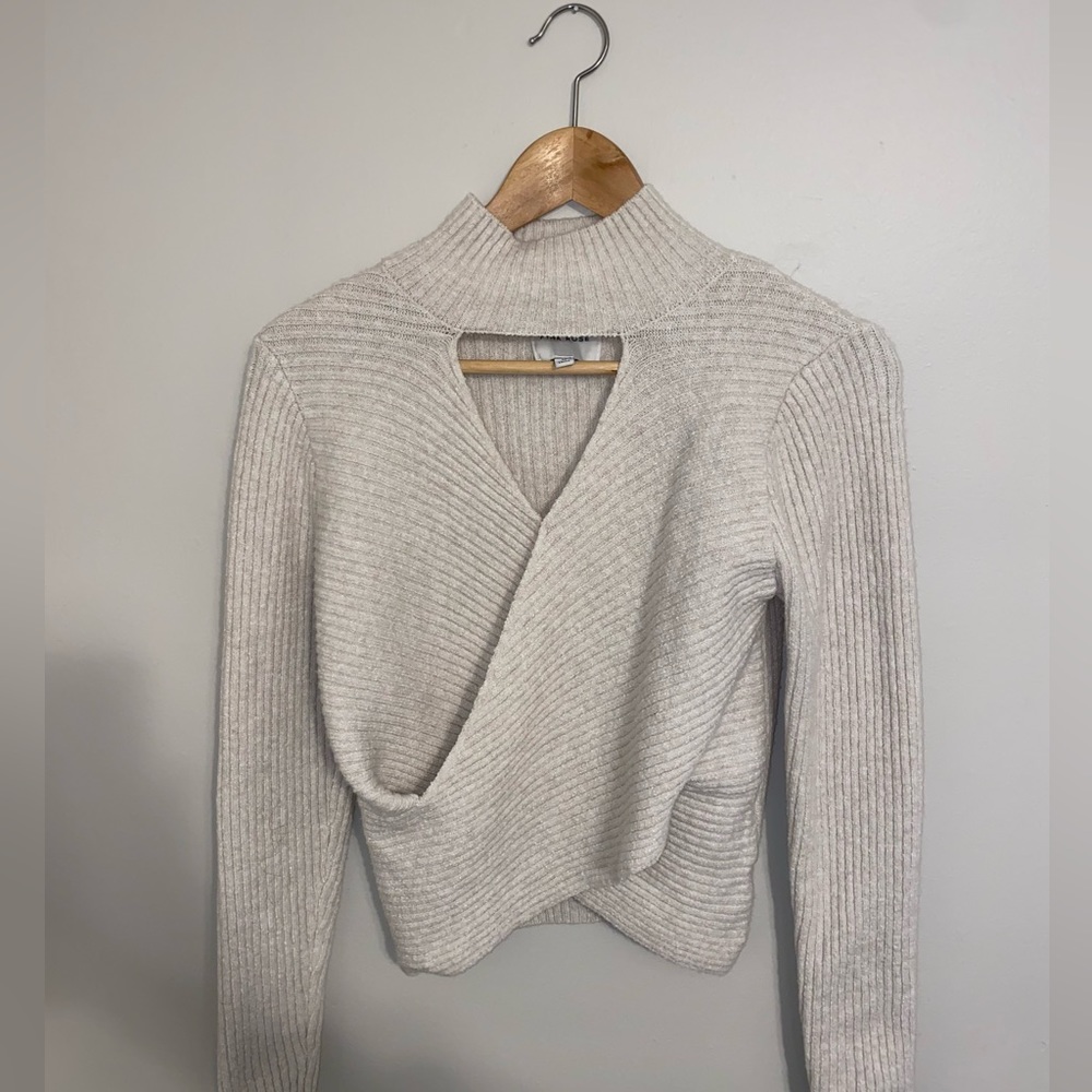 Cute Pink Rose cream sweater! Sized Medium and crisscrossed at the waist.
